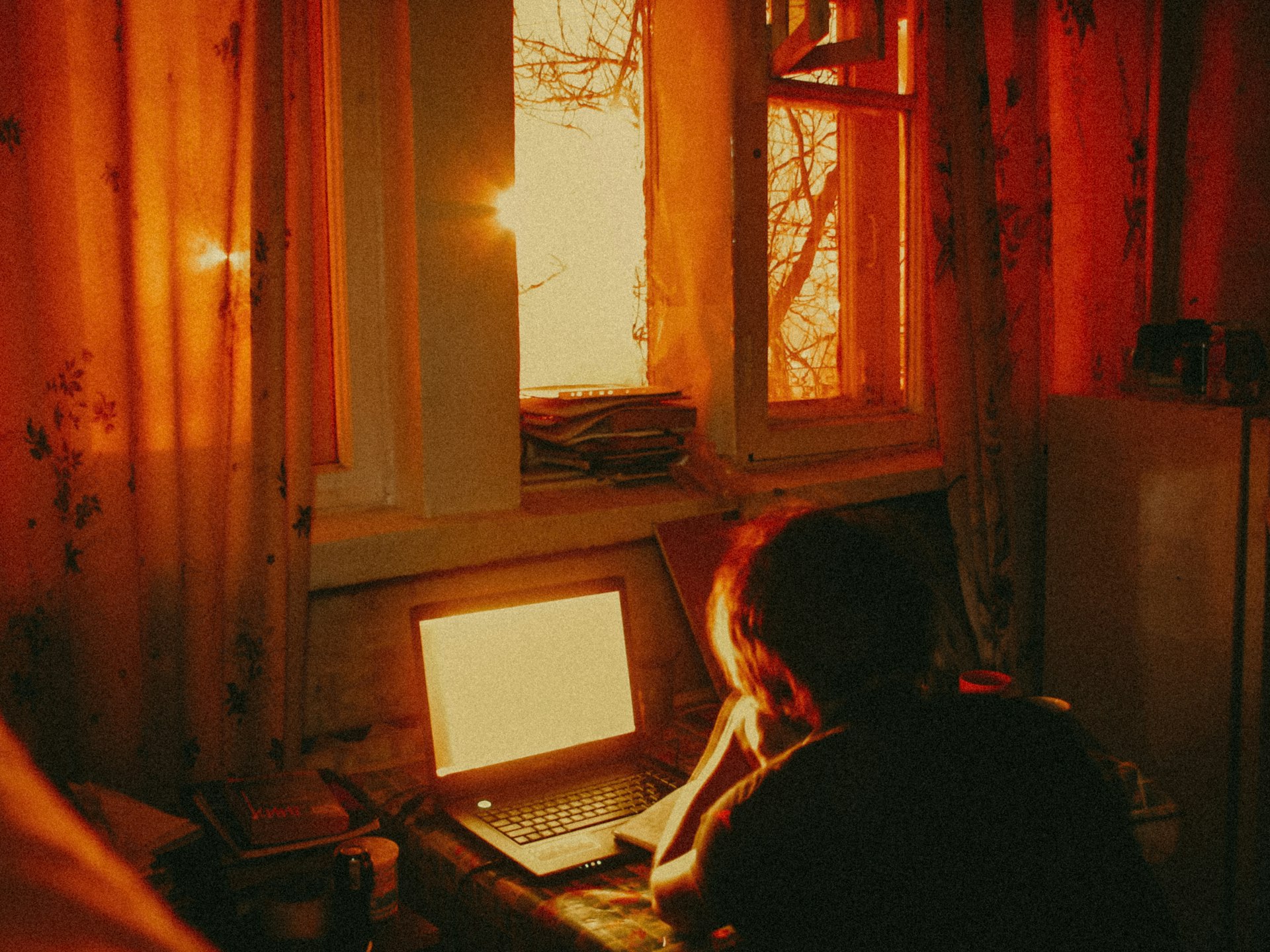 woman sitting on chair using laptop computer